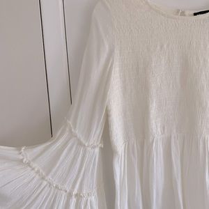 American Eagle creamy peasant top size medium